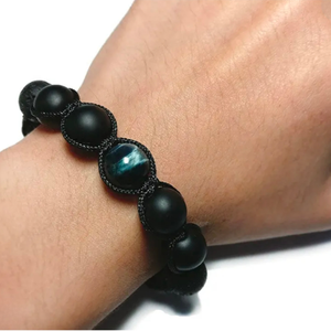 Lava Agate and Tiger Eye beaded macramé bracelet from T.M.J featuring natural stone beads and intricate knot detailing.