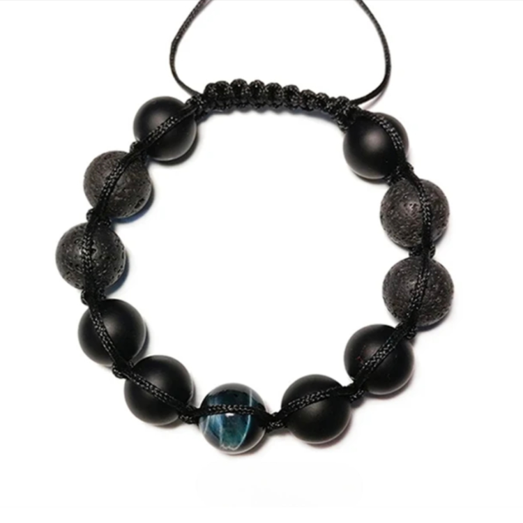 Lava agate and tiger eye beaded macramé bracelet by T.M.J, featuring natural stone beads and intricate knotting details.