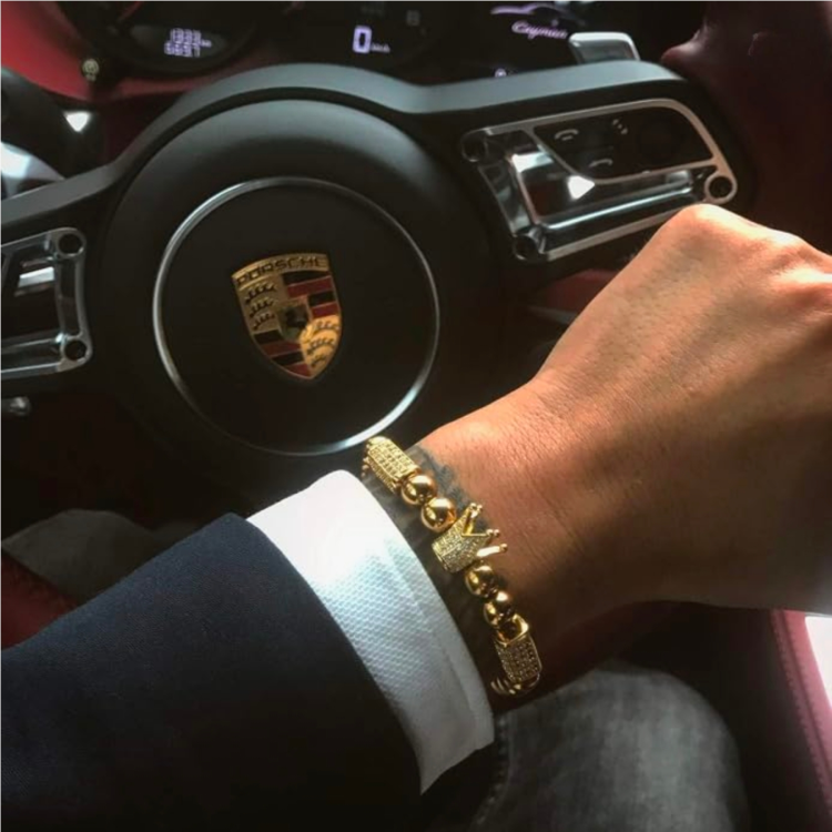 Gold CZ crown macrame bracelet worn on a man's wrist