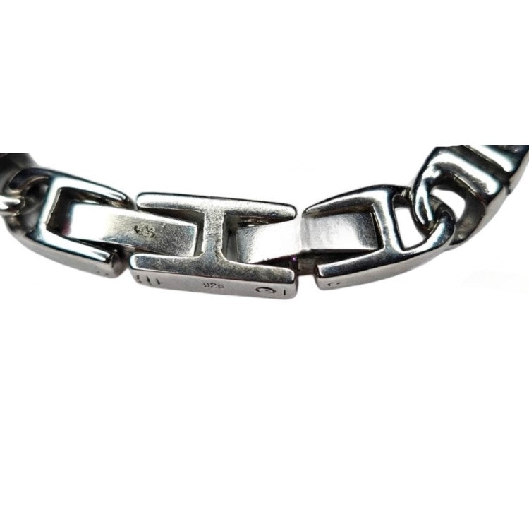 Stainless steel Meridian Balinese J-Link horseshoe bracelet by T.M.J, featuring intricate metal construction and horseshoe design.