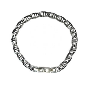 T.M.J Meridian Balinese J-Link horseshoe stainless steel bracelet with intricate metal design on a neutral background.