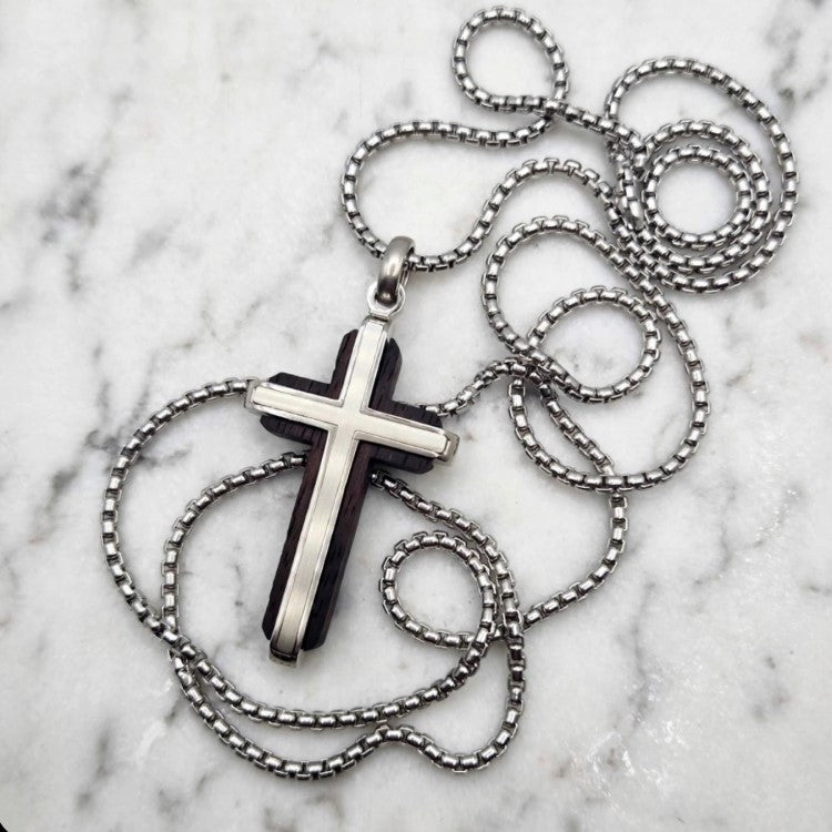 Dresden ebony wood cross by Cudworth featuring a channel-set satin steel accent, showcasing intricate craftsmanship and smooth polished finish.