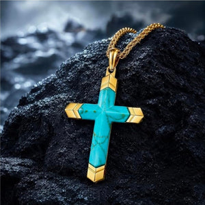 Turquoise cross pendant by Cudworth on gold PVD stainless steel, featuring a detailed cross design with vibrant turquoise accents.