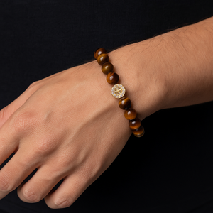 T.M.J tiger eye bead bracelet for men with round polished beads and decorative gold accent