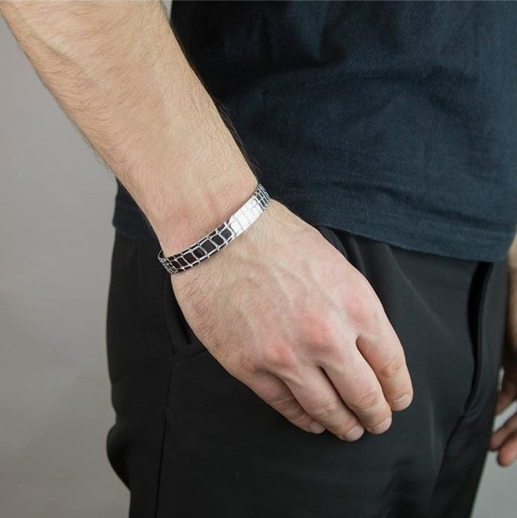 Sterling silver Hoxton London bangle with a wild style crocodile pattern, featuring textured, patterned design on a sleek bracelet.