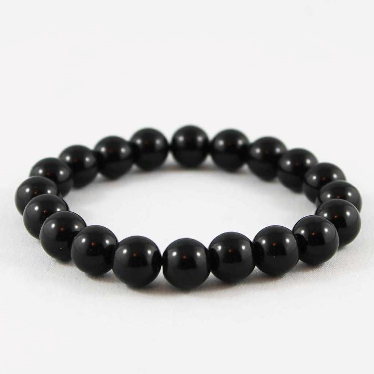 Polished black onyx beaded bracelet from T.M.J, 17cm, 4mm round beads, stylish jewelry accessory.