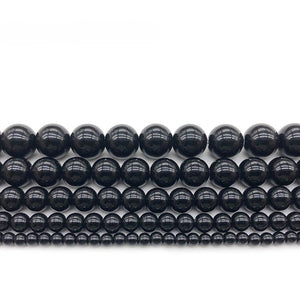 Polished black onyx beaded bracelet by T.M.J featuring 4mm round beads on a 17cm stretch bracelet.
