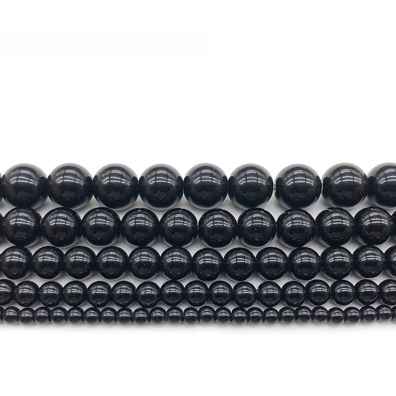 Polished black onyx beaded bracelet by T.M.J featuring 4mm round beads on a 17cm stretch bracelet.