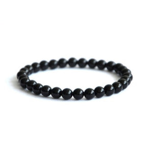 Polished black onyx beaded bracelet by T.M.J, 17cm, 4mm round beads, stylish and elegant jewelry accessory.