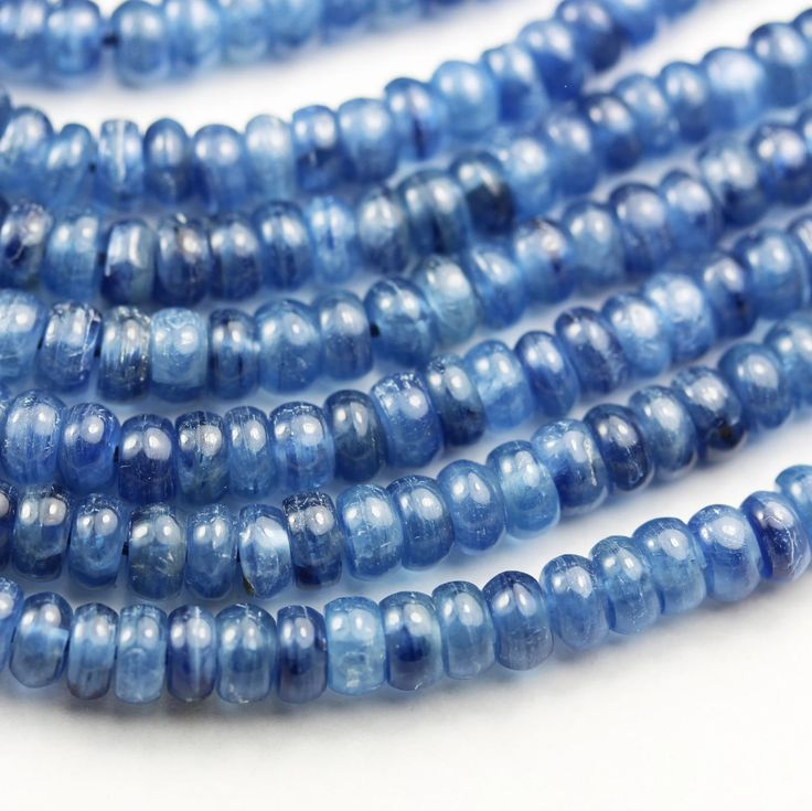 Dark blue Brazilian Kyanite crystal bead bracelet by T.M.J, featuring 6mm, 8mm, 10mm, and 12mm beads on a stretch cord.