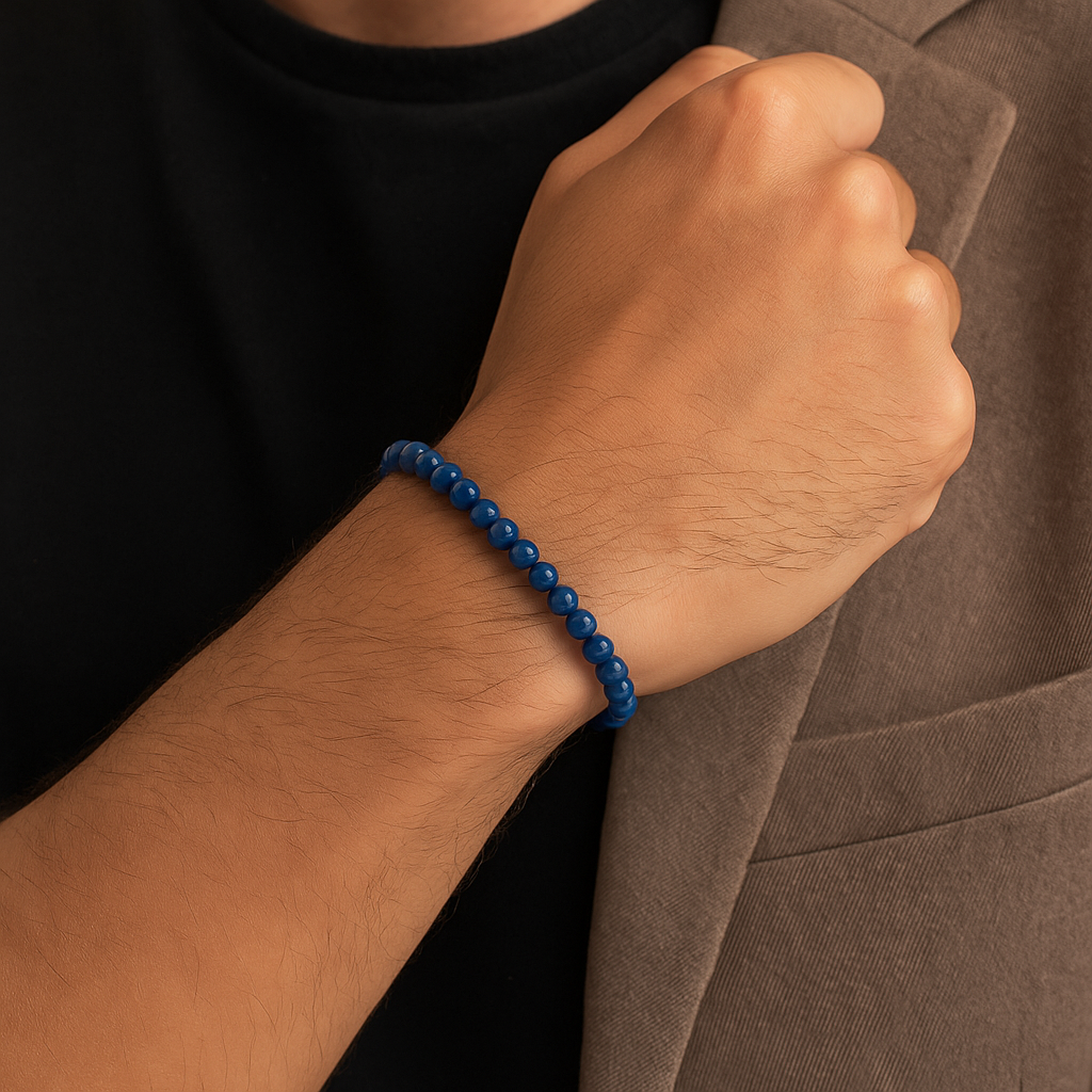 Dark blue Brazilian Kyanite crystal bead bracelet by T.M.J, featuring 6, 8, 10, and 12mm beads on a stretch cord.