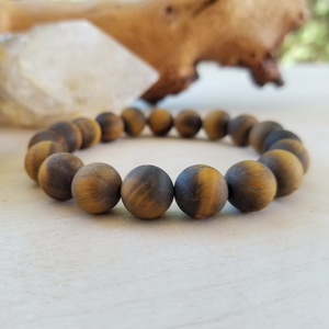 Matte Tiger Eye bead bracelet with 6mm beads, 17cm length, by T.M.J, featuring a smooth, polished gemstone design.