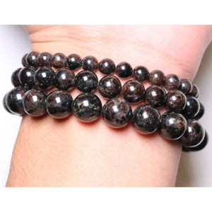 Astrophyllite and hornblende beaded bracelet by T.M.J with silver logo bead, 17cm length, 8mm beads, stylish jewelry accessory.