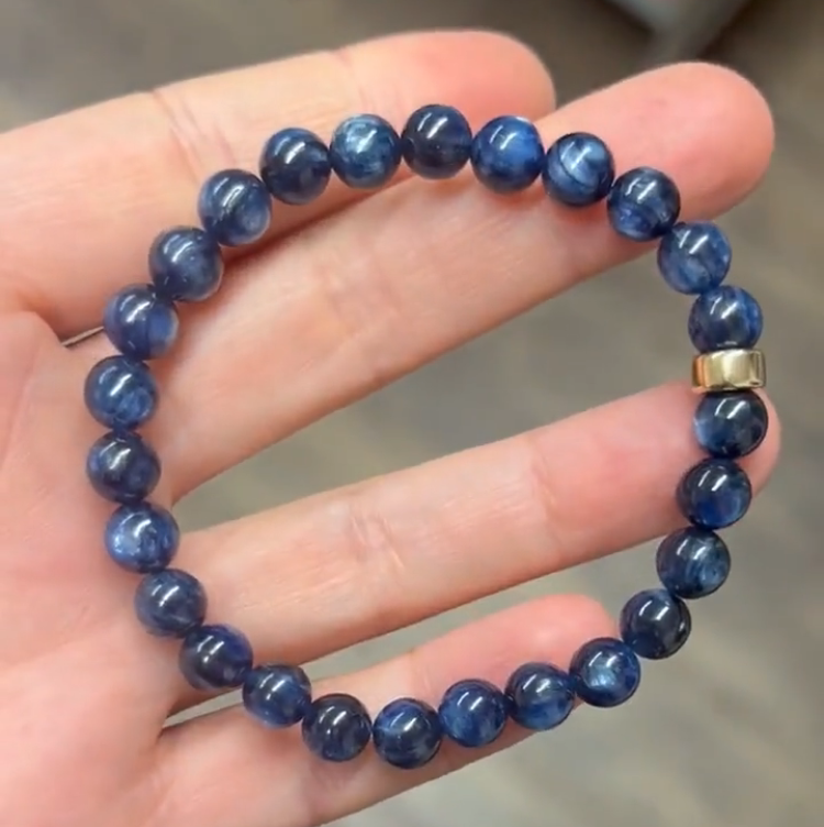 Dark blue Kyanite crystal beaded bracelet with 7.5mm plain beads from T.M.J, showcasing a stylish and natural gemstone jewelry piece.
