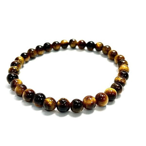 Tiger Eye and silver bead bracelet with 17mm and 4mm beads from T.M.J, featuring polished tiger eye stones and silver accents.