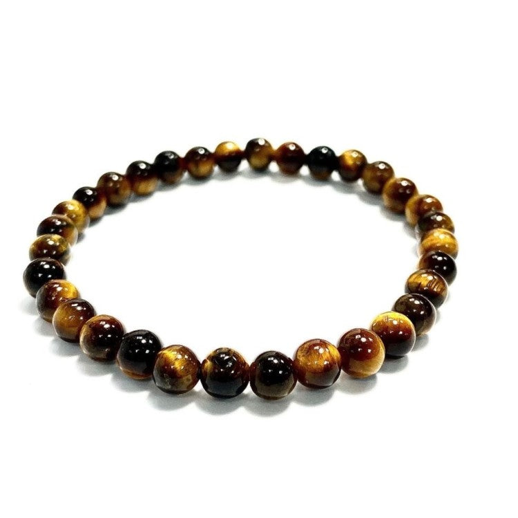 Tiger Eye and silver bead bracelet with 17mm and 4mm beads from T.M.J, featuring polished tiger eye stones and silver accents.