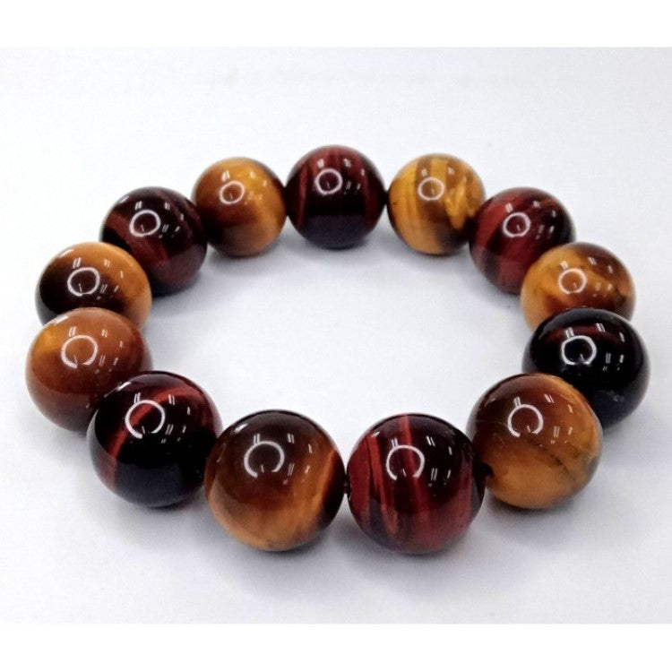 Tiger Eye and silver bead bracelet with 17mm and 4mm beads from T.M.J, showcasing polished tiger eye stones and silver accents.