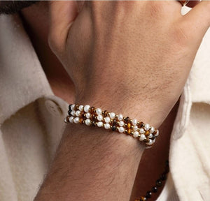 T.M.J Melbourne Collection men's wrap bracelet with white pearls, tiger eye, and gold beads, showcasing a stylish beaded accessory.