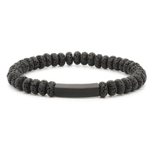 Black Eclipse Lava Bead Bracelet by T.M.J with stainless steel accent, featuring textured lava beads and sleek metal details.