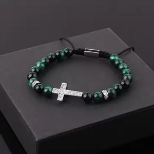 Natural 6mm stone beaded CZ cross charm macrame bracelet by T.M.J with brown beads and intricate knot details.