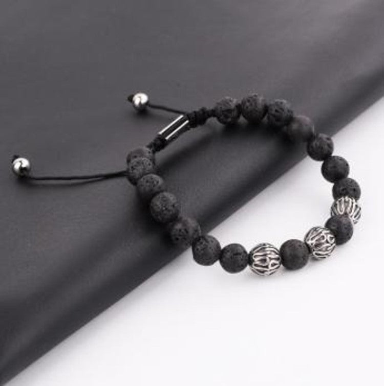T.M.J bead bracelet featuring brown tiger eye stones, macramé design, stainless steel spacer beads, and natural stone accents.