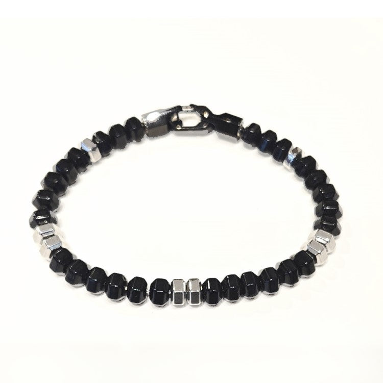 Black agate hexagonal bead bracelet by T.M.J featuring stainless steel accents, showcasing the detailed geometric beads.