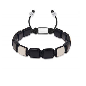 T.M.J Eye of Dharma flatbead bracelet featuring matte onyx and silver beads, showcasing a stylish beaded jewelry design.