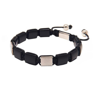 T.M.J Eye of Dharma Flatbead Collection beaded bracelet with matte onyx and silver accents, showcasing a sleek, modern design.