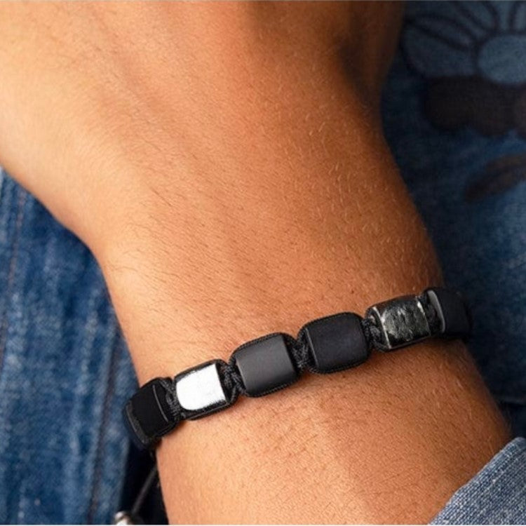 T.M.J Eye of Dharma Flatbead Collection bracelet featuring matte onyx and silver beads, stylish beaded jewelry for wrist.