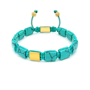 Turquoise and gold Eye of Dharma flatbead bracelet from T.M.J's Bead Bracelets collection, featuring vibrant beads and intricate design.