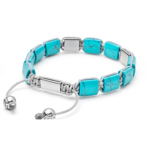 Turquoise and silver eye of Dharma flat bead bracelet from T.M.J's Bead Bracelets collection, featuring detailed bead designs.