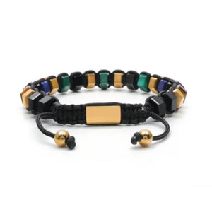 T.M.J HexaLuxe men's beaded bracelet with multi-colored tiger eye and gold-tone hexagon beads on a black background.