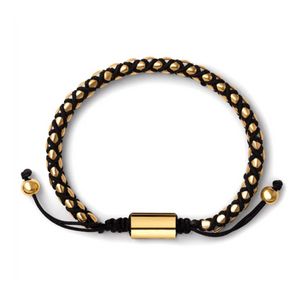 Crimson Weave SteelLink bracelet with braided black cord, T.M.J bead bracelet featuring gold-tone accents and intricate woven design.