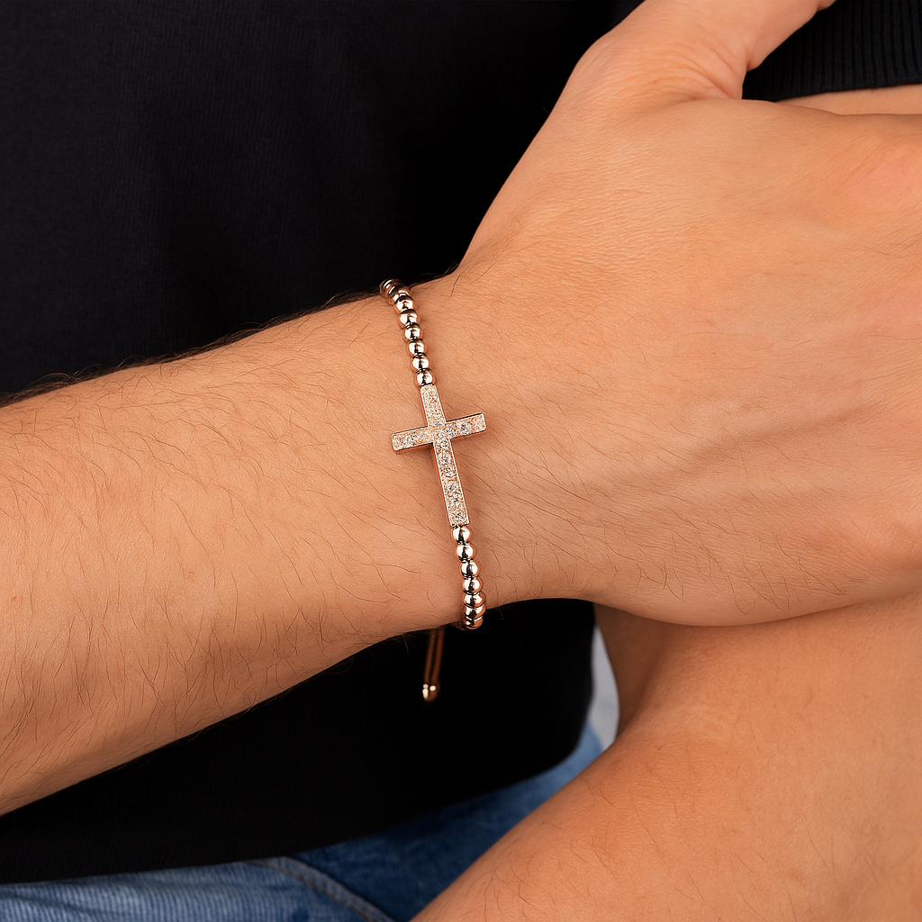 Luxury CZ diamond cross charm on gold bead macrame bracelet by T.M.J, featuring intricate beaded design and elegant jewelry style.