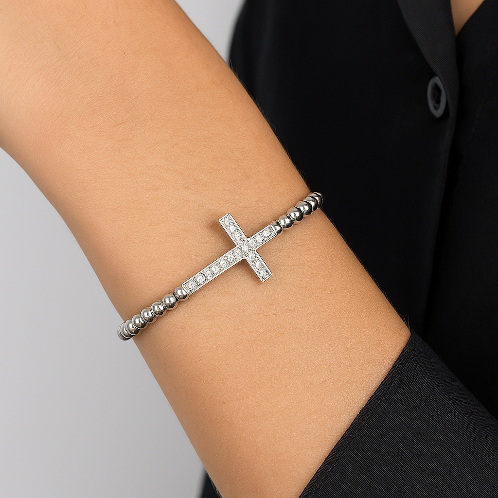 Gold beaded macrame bracelet with a CZ diamond cross charm, luxury T.M.J bead bracelet accessory.