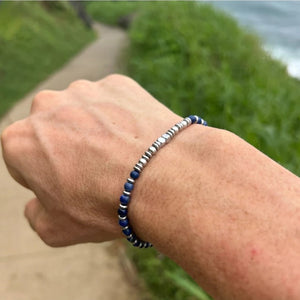 Men’s blue tiger eye bead bracelet with stainless steel accents, featuring natural tiger eye stones and stylish men's jewelry design.