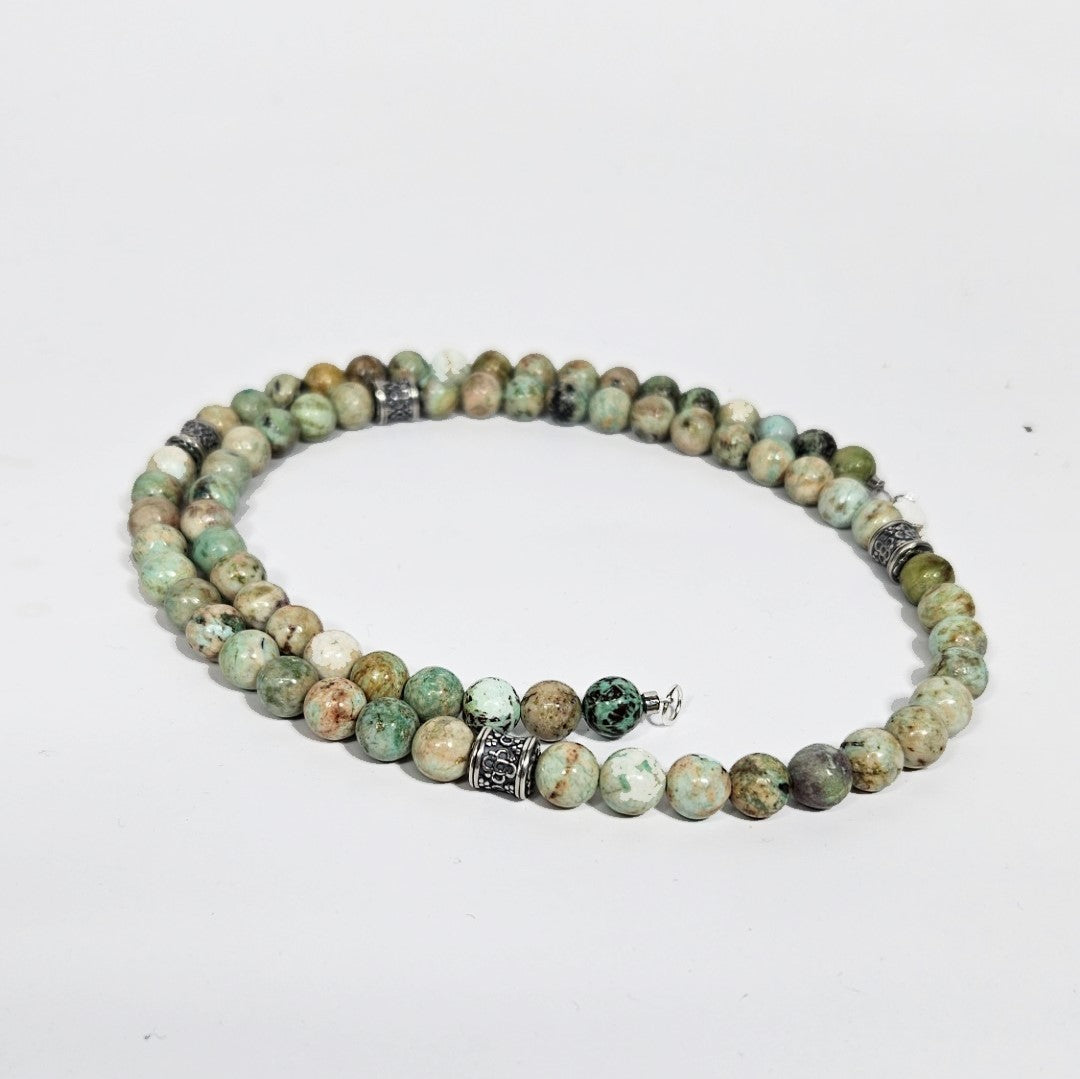 Peruvian turquoise and sterling silver beaded necklace, 45cm, featuring vibrant turquoise beads and silver accents by T.M.J.
