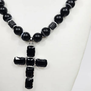 Large silver cross beaded necklace by T.M.J with Austrian crystals on Botswana Agate pendant, showcasing detailed craftsmanship.