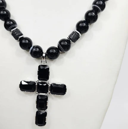 Large silver cross beaded necklace by T.M.J with Austrian crystals on Botswana Agate pendant, showcasing detailed craftsmanship.