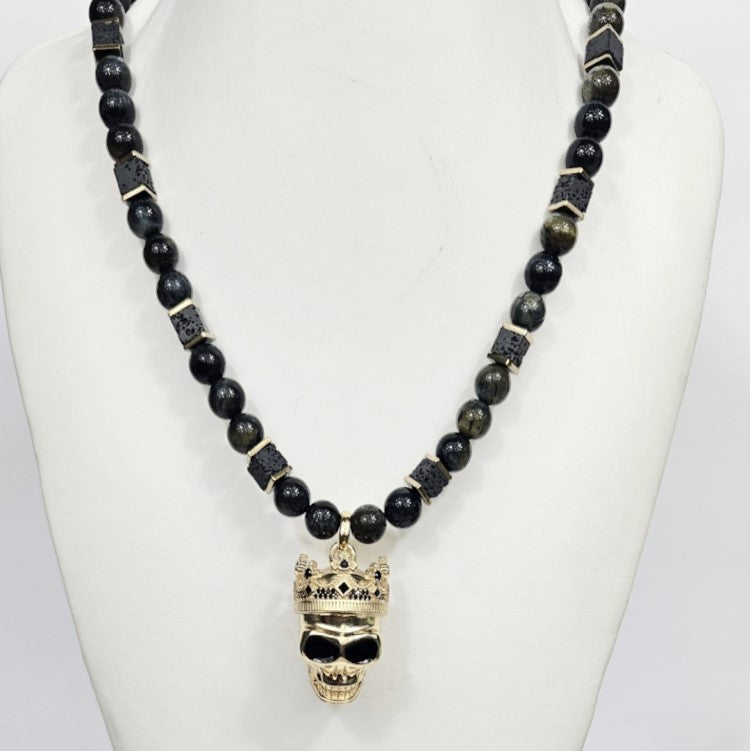 Large silver and gold-plated skull pendant with crown on blue tiger eye beaded necklace by T.M.J.