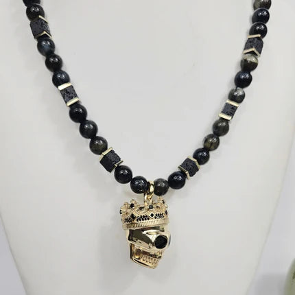 Large silver and gold-plated skull with crown pendant on blue tiger eye beaded necklace, T.M.J beaded jewelry.