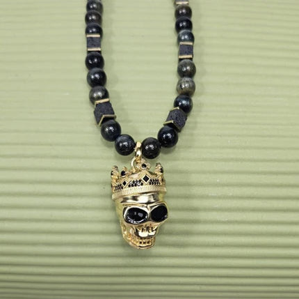 Large silver and gold plated skull pendant with crown on blue tiger eye bead beaded necklace by T.M.J.