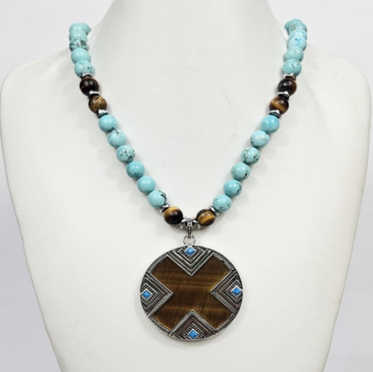 Large silver tiger eye pendant on turquoise and tiger eye beaded necklace, crafted by T.M.J, featuring natural gemstone stones.