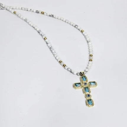 Solenne silver gold-plated cross with aquamarine crystals on faceted howlite bead necklace, T.M.J beaded jewelry.