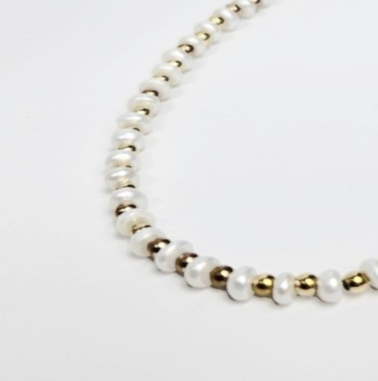 Mini beaded necklace by T.M.J featuring pearls and stainless steel spacer beads, 45cm silver-toned jewelry accessory.