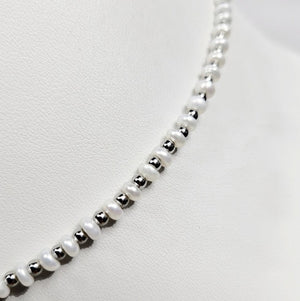 Mini beaded necklace by T.M.J featuring pearls and stainless steel spacer beads, 45cm silver-toned jewelry accessory.