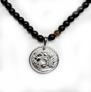 Beaded stainless steel necklace with Nemean Lion pendant, Greek mythology design, T.M.J brand, featuring intricate beaded details and pendant.