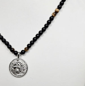 Stainless steel beaded necklace with Nemean Lion pendant inspired by Greek mythology, featuring detailed lion design and beaded chain.