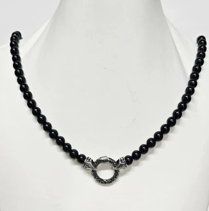 Black Onyx beaded necklace with a silver and Onyx North Star pendant, featuring polished beads and a detailed star-shaped charm.