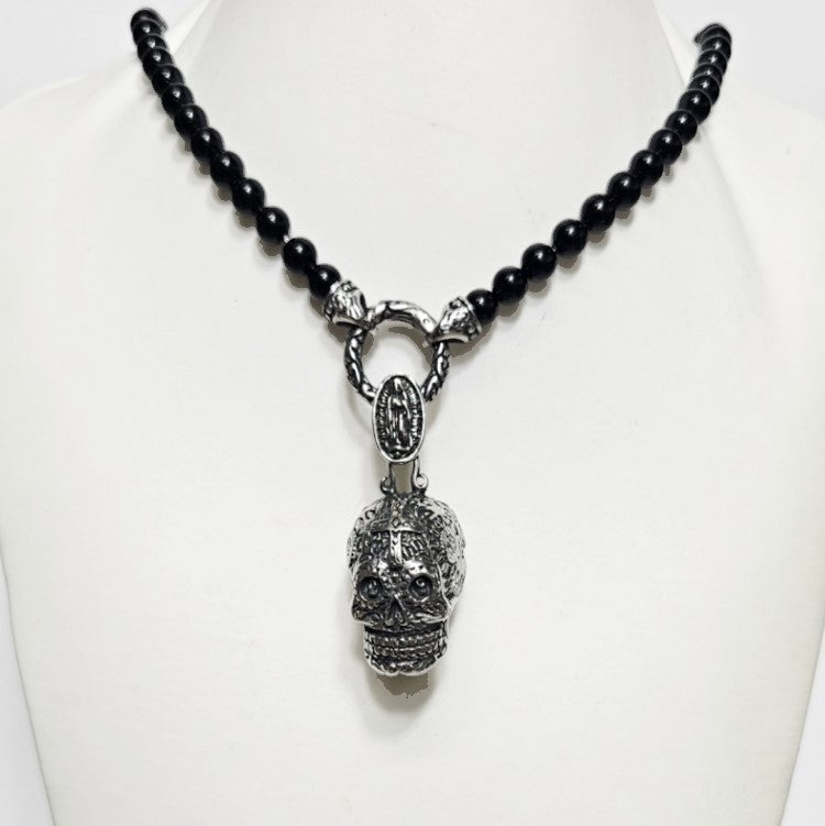 Black Onyx beaded necklace with stainless steel Day of the Dead skull pendant, featuring a detailed silver skull pendant design.